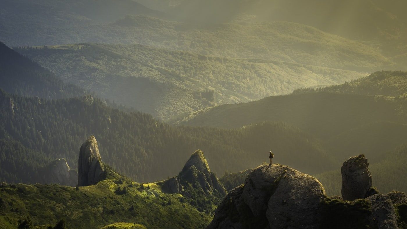 Layered evergreen mountains in the Pacific Northwest, mist drifting through the valleys